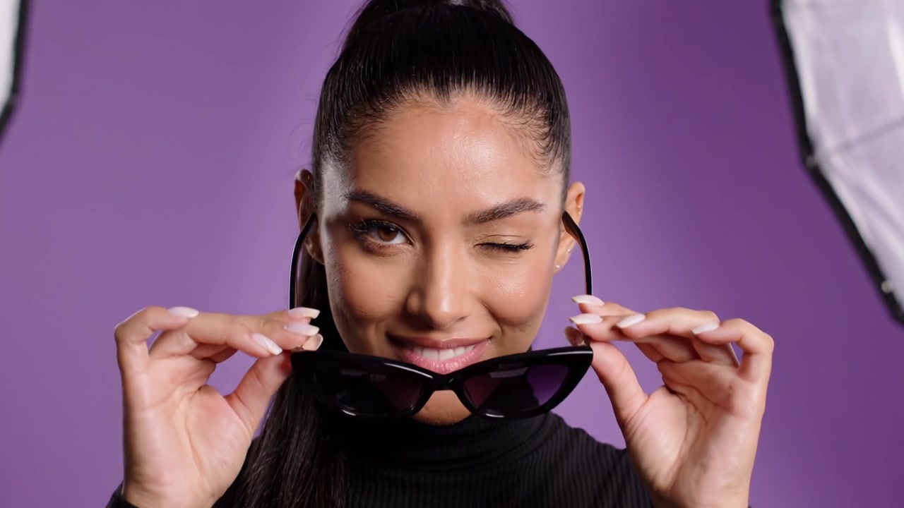 Fashionable Model Showcases Stunning Eyewear and Confidence in Dynamic Portrait Sequence Against Vibrant Purple Background
