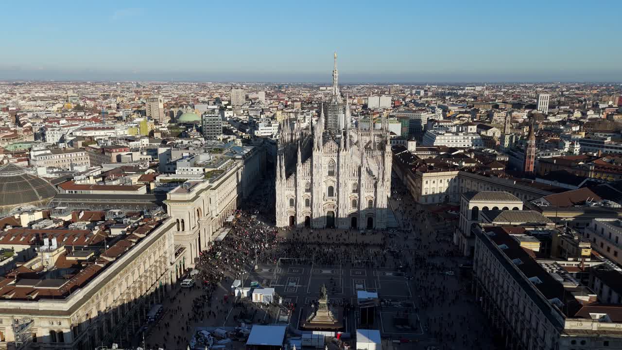 aerial wide angle drone above Milan Duomo Cathedral main square with galleria Vittorio Emanuele and cityscape , blue clear sky Italy European capital city