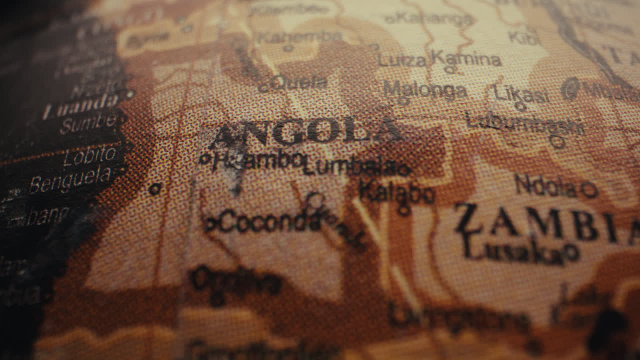 Close-up of a vintage world globe map showing Angola and Zambia