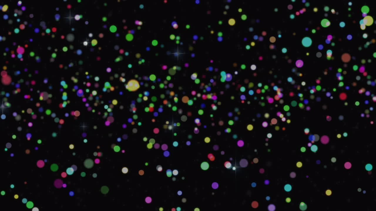 Animation of glowing multi coloured spots over black background