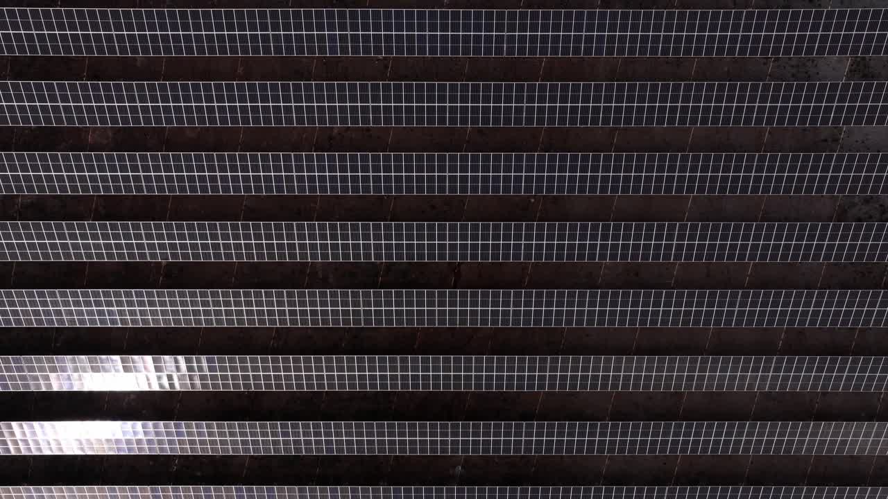 Drone view of ongoing solar farm development in rural landscape
