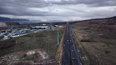 awesome aerial view of s redwood road and beautiful landscape in bluffdale utah, truck left and panning movement