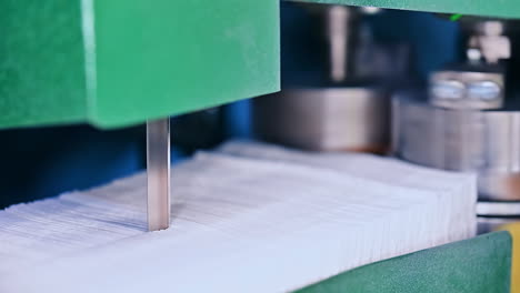 automated rolling sheets of cellulose for making diapers. conveyor technology big rolls proccesing.