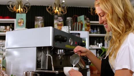 waitress making cup of coffee