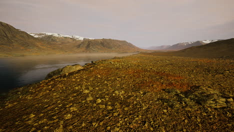 Atmospheric-landscape-with-mountain-lake-among-moraines-in-rainy-weather