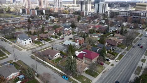 Drone-circling-over-overcast-and-grey-suburb-in-the-spring-in-Toronto