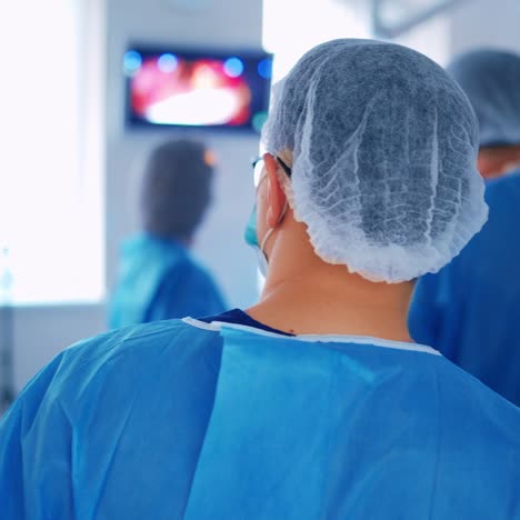 in surgery. medical team performing operation in hospital operating theater. working with surgical instruments.