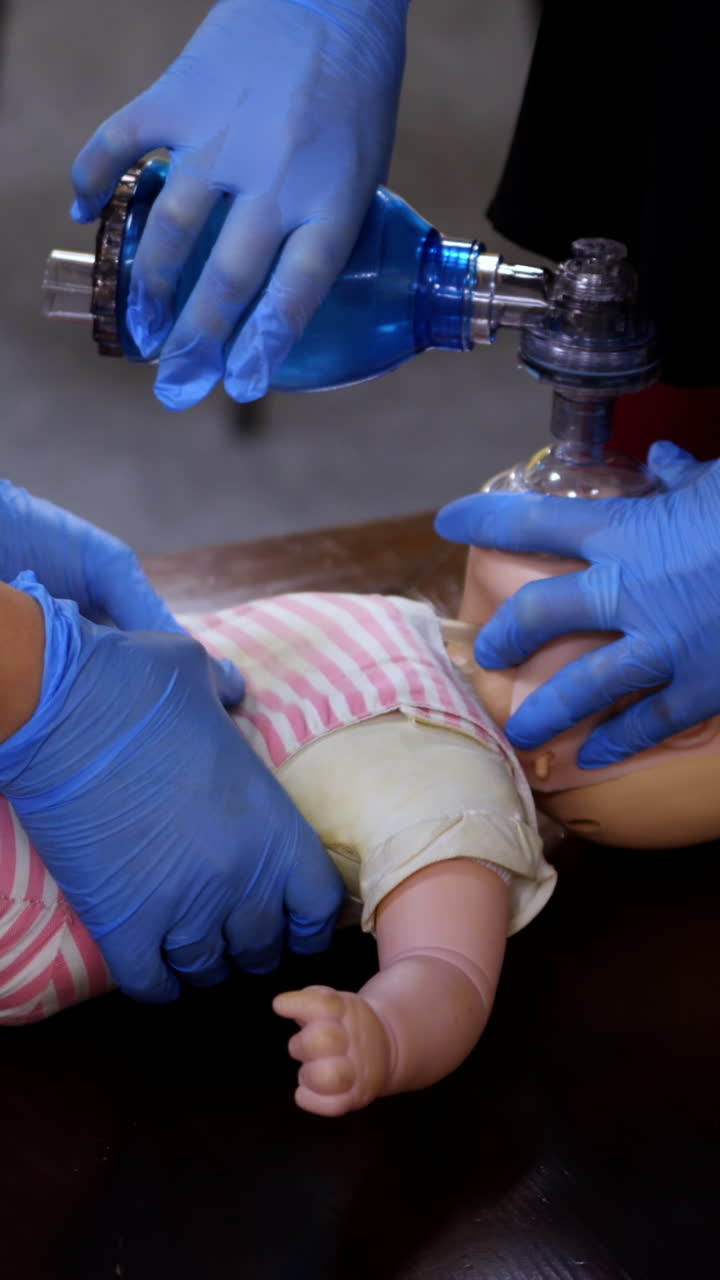 CPR training medical procedure. Demonstration of breast compression on ...