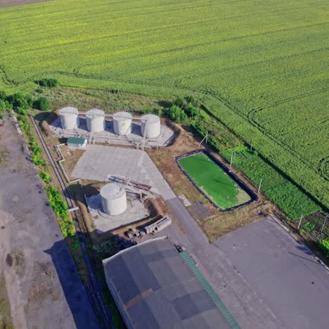 aerial view of an industrial facility surrounded by a sunflower field