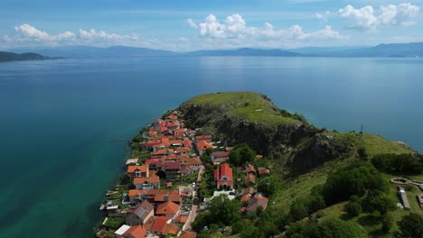 village of lin on the rocky peninsula edge along the beautiful shoreline of lake ohrid surrounded by emerald calm waters