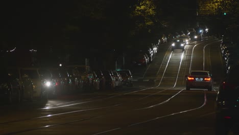 Baltimore-Avenue-Traffic,-Cars,-Headlights,-night,-West-Philadelphia