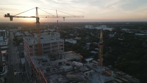 Aerial-Skyscrapers-in-Downtown-Miami-with-Construction-Development-During-Sunset