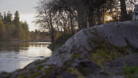 Camera-pans-over-beautiful-river-at-sunset-1