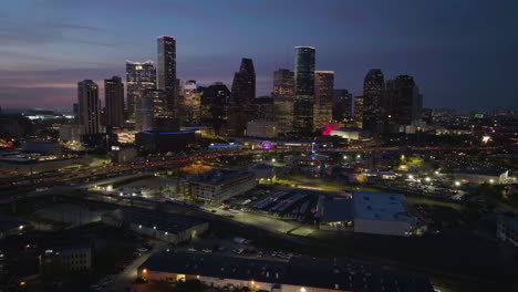 Establishing-drone-shot-of-the-Houston-city-skyline,-vibrant-dawn-in-Texas,-USA