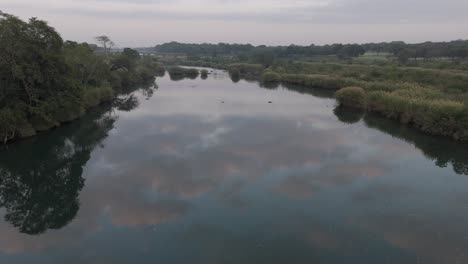drone flies low over the seasonal komati river, revealing the vastness of the bushveld