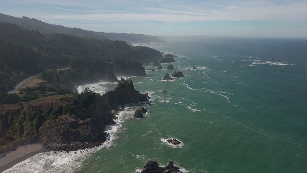 Scenic Coastal Landscape with Rocks, Waves, and Forest