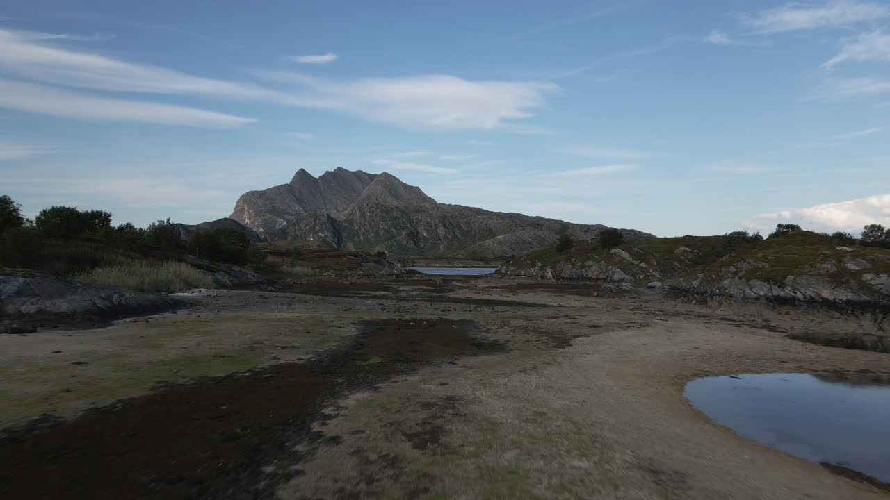 Norwegian Landscape Around Mount Donnamannen In Donna, Helgeland, Norway. wide drone shot
