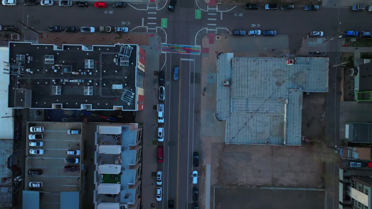 Rhino Birdseye view Downtown Denver cityscape city tall skyscraper buildings aerial drone Colorado spring summer afternoon sunset mountains range landscape stormy clouds sunny forward motion