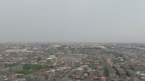 Aerial-shot-of-Jakande-slum-in-Lekki,-Lagos,-Nigeria,-Africa