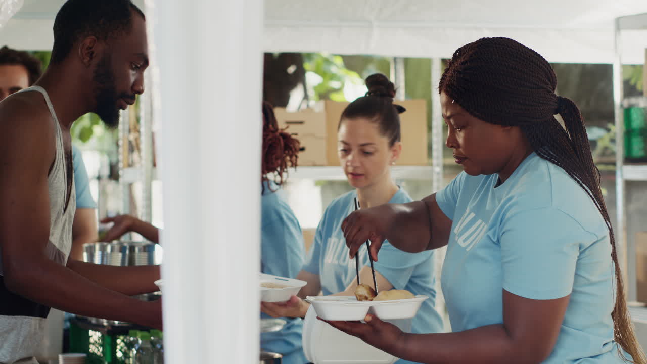 Charity Workers Serve Free Food To Needy