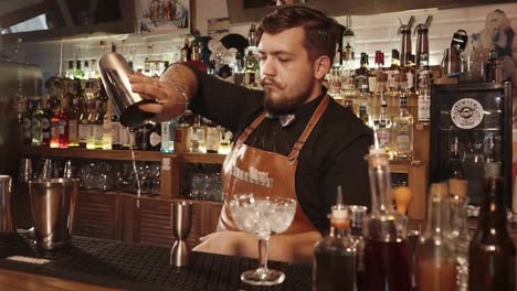 bartender making cocktails at a bar