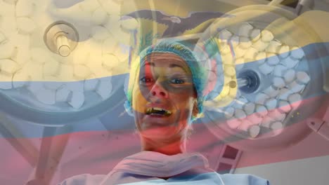 animation of flag of colombia waving over anesthesiologist in operating theatre