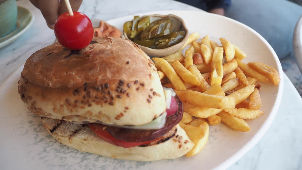 Burger with french fries and pickles