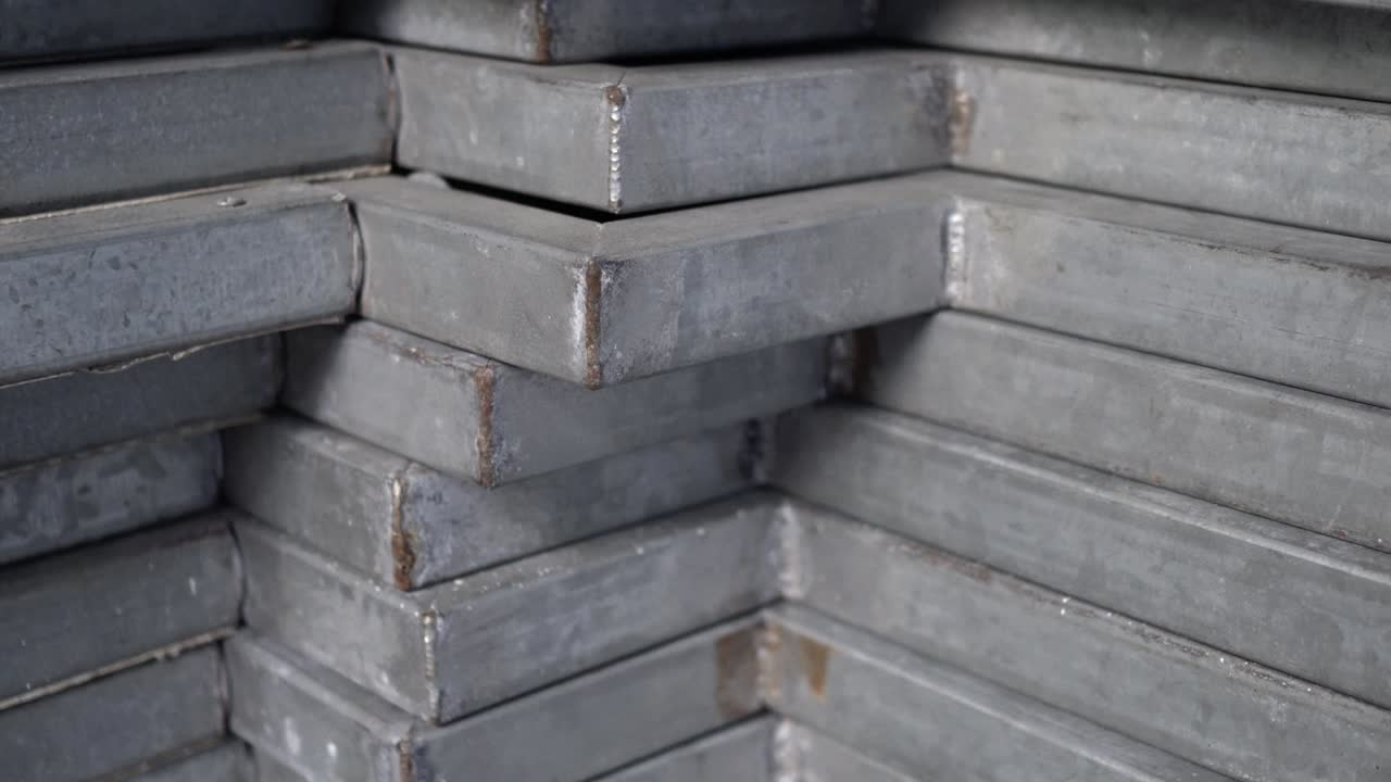 Metal recyclables are neatly arranged. Appearance is old. Tilt shot from bottom to top.