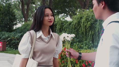 girl rejecting flowers from boy