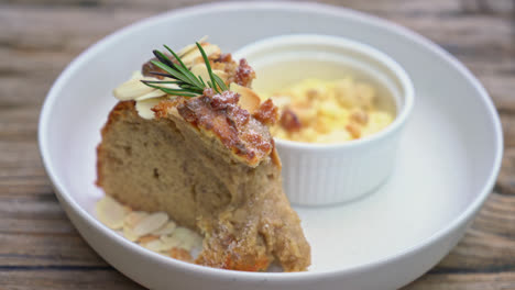 banana cake with cream cheese and crumble on plate