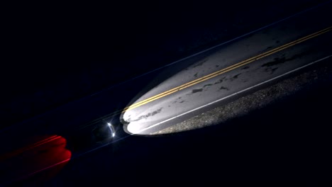 drone view of car driving on a night country road with headlights, seamless loop