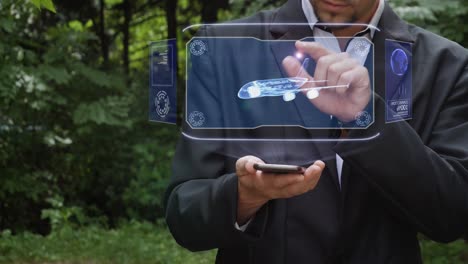 businessman uses hologram with large passenger aircraft
