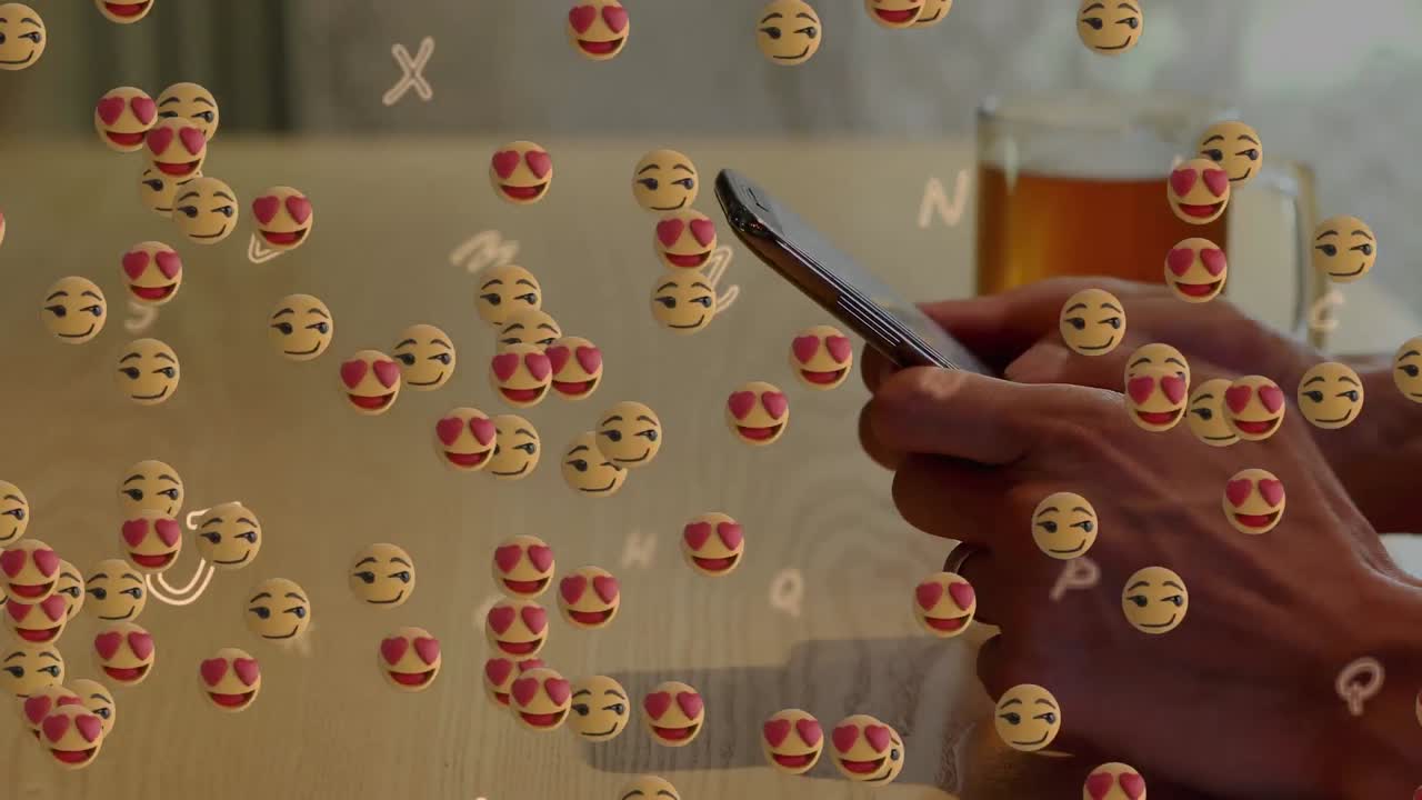 animación de emojis flotantes sobre la mano usando un teléfono inteligente