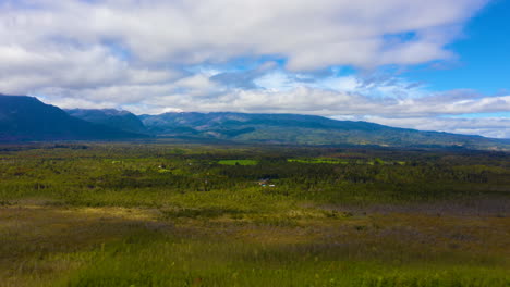 Dolly-time-lapse-looking-across-the-the-Chilean-countryside-with-mountains-in-the-background,-bright-sunny-day