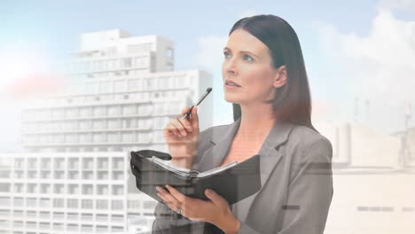 animation of businesswoman writing over cityscape