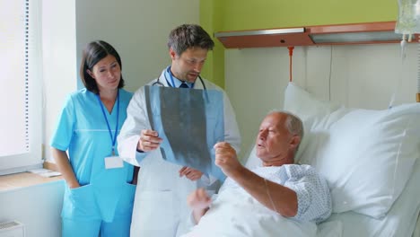 doctor discussing x-ray with patient