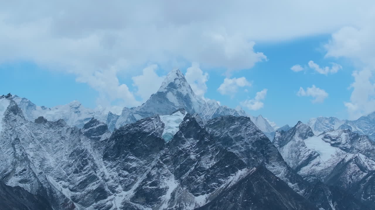 Landscape view of Ama Dablam mountain ranges from Kala Patthar at Everest Base Camp, Nepal. Majestic peak, cloudy skies, and painting-like Himalayas highlight climate change and high-altitude beauty