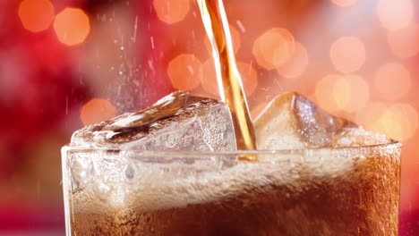 glass of cola. ice cola with splashing bubbles slow motion on a blurry light ,blurry background.