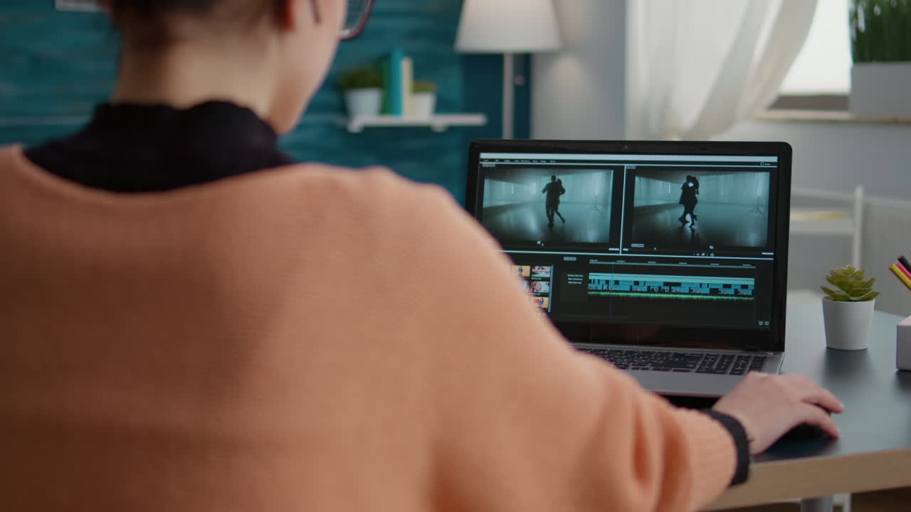 Content creator using video editing software to design montage