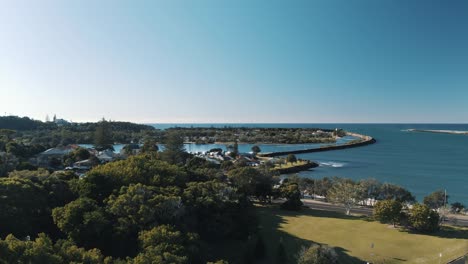 aerial view of a coastal recreational landscape featuring a beach, trees, and peaceful surroundings, ideal for relaxation and enjoying nature’s beauty