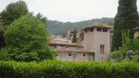 charming deia village in mallorca's lush landscape. perfect for travel documentaries showcasing mediterranean architecture.