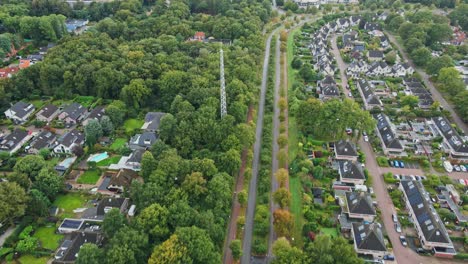 aerial view of suburban neighborhood with communication tower