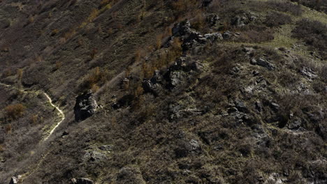 aerial drone shot of burnt out rocky hillside near rock canyon, utah