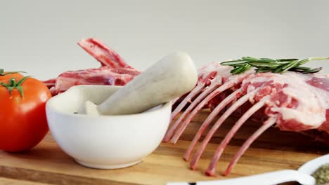 beef rib chops and ingredients on wooden floor