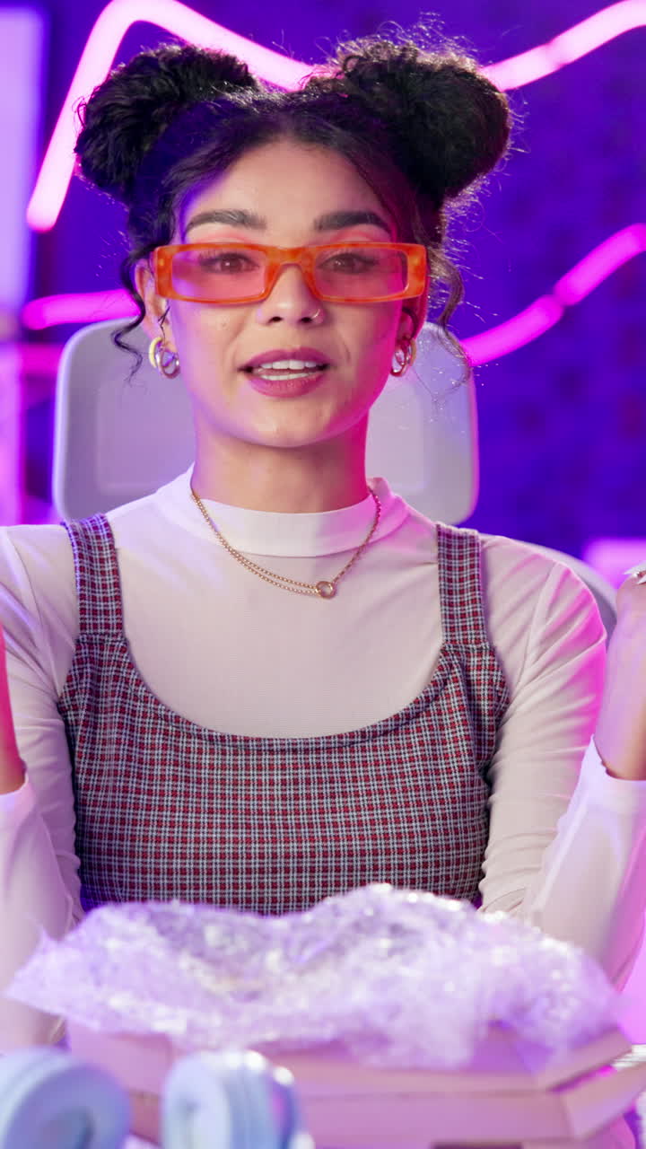 Portrait of a woman wearing orange glasses