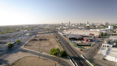 aerial view of a city with highways and railway tracks