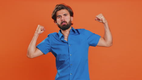 man showing biceps and looking confident, feeling power strength to fight for rights, success win