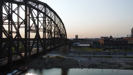 Silhouette-of-Bridge-Crossing-Mississippi-River-into-St