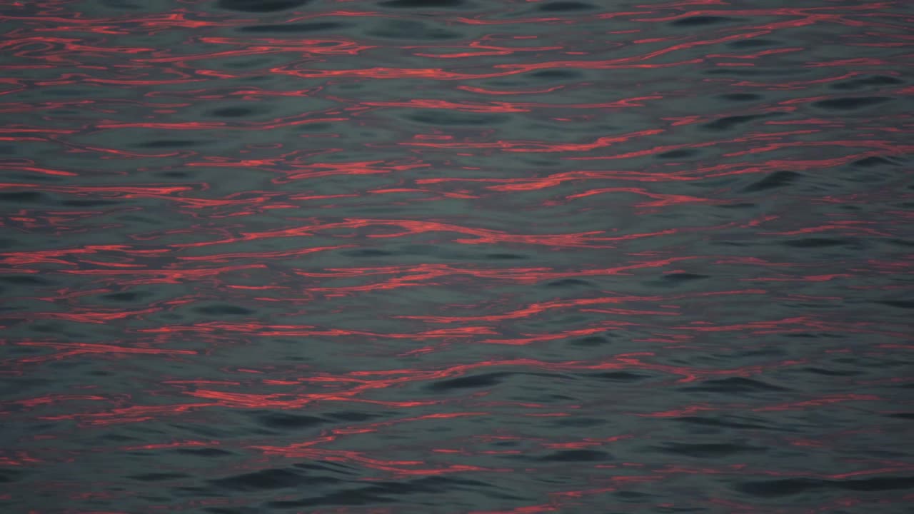 Reflections on the water of the sunset during golden hour