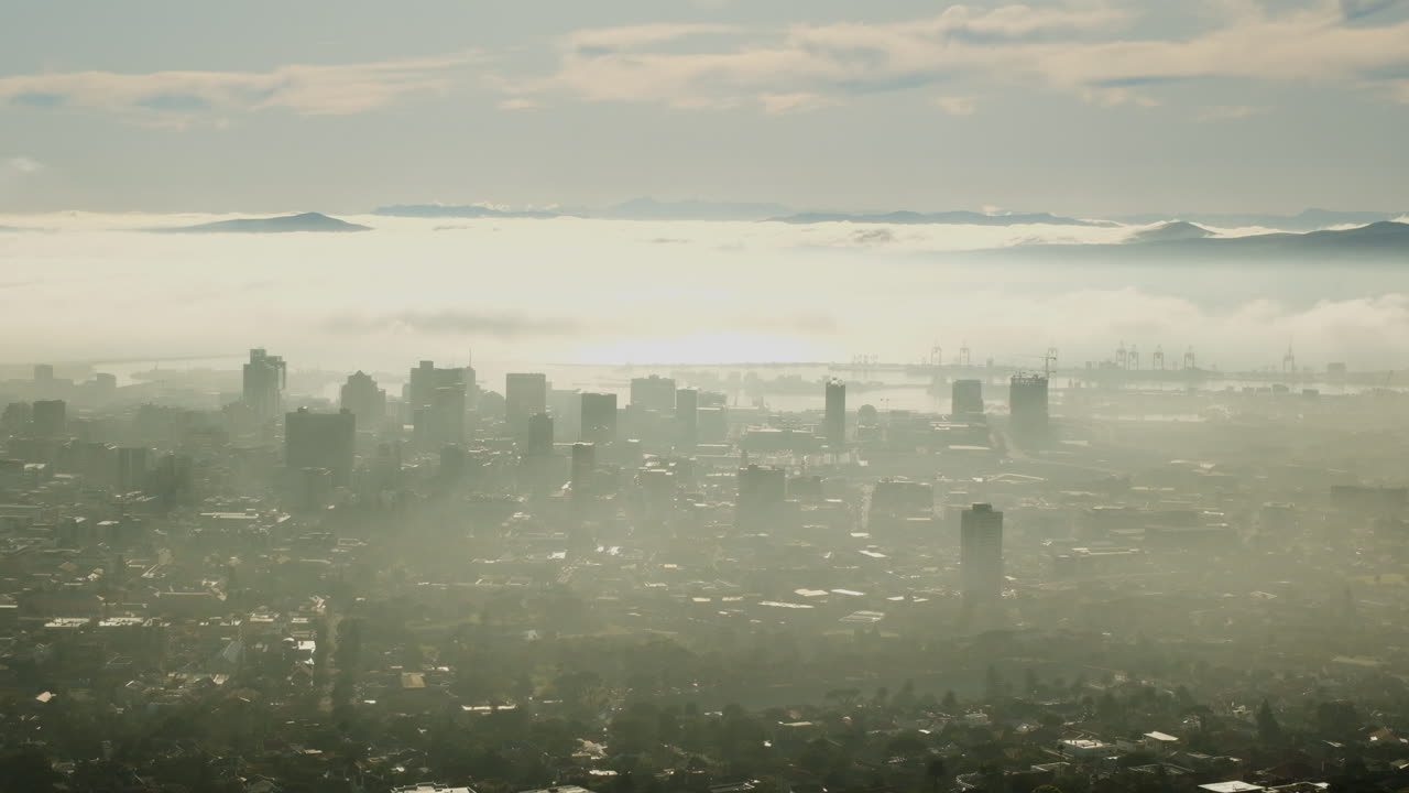 Cape Town city bowl enveloped by low cloud, high risers visible
